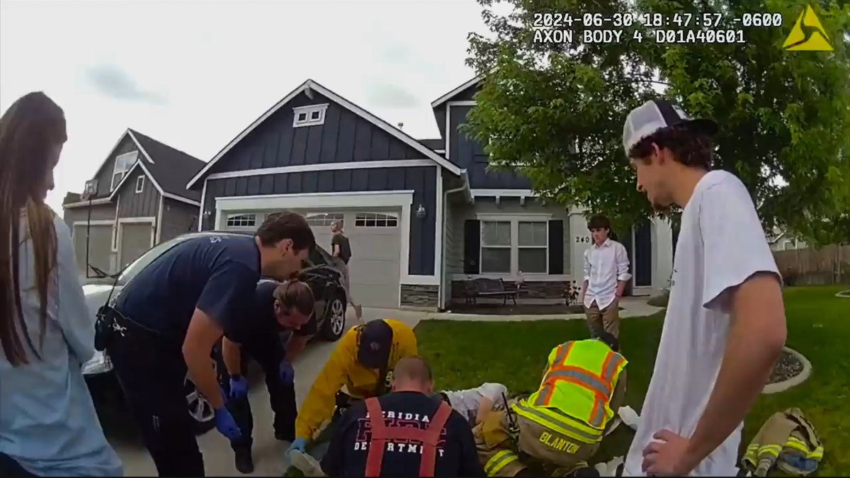 Paramedics attend to Parks Allen, 16, after he lost control of his dirt bike on Ensenada Drive in Meridian. Allen’s mother, Rachel, and oldest brother, Samson, stand watching the scene.