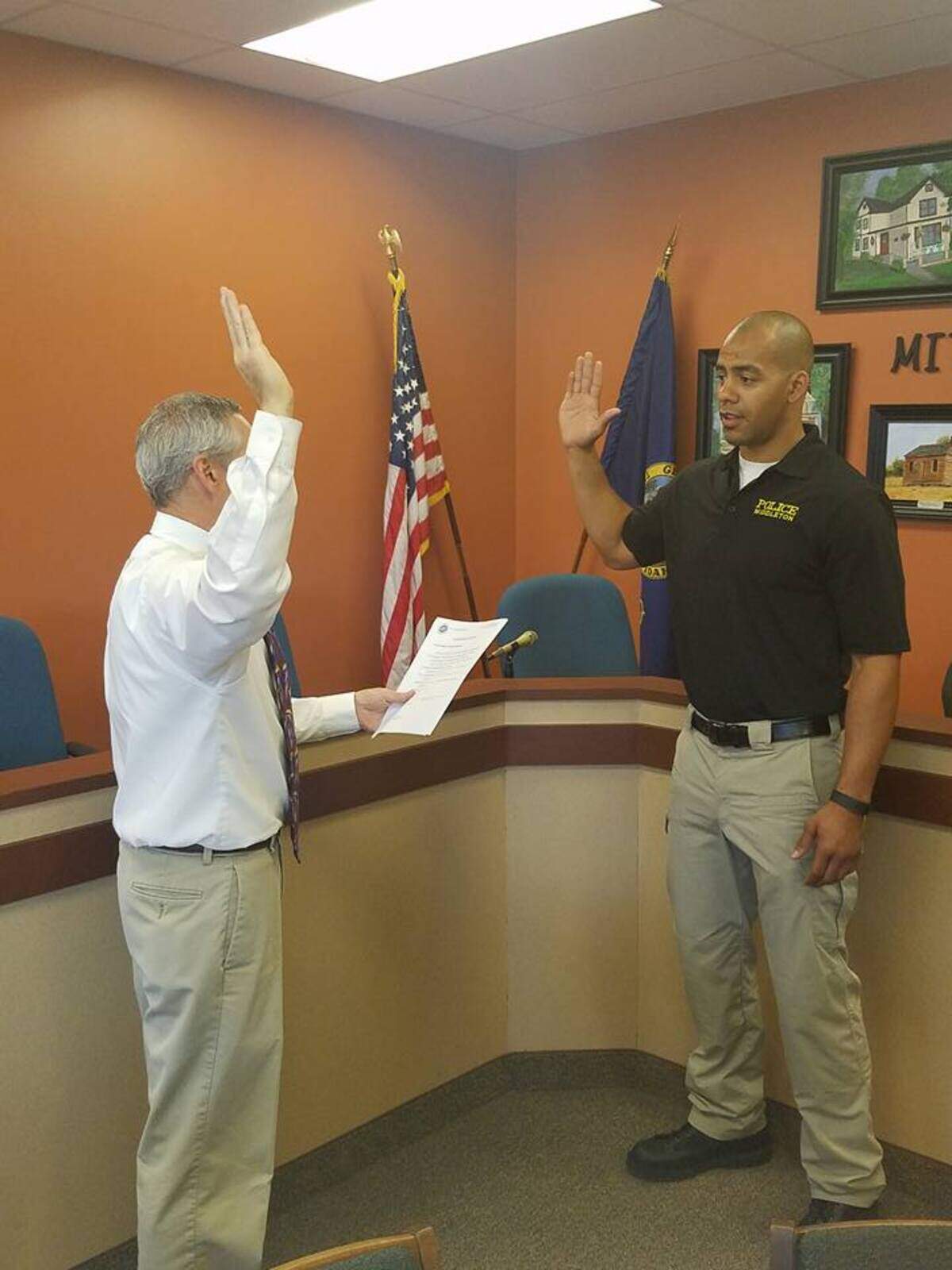 Former Middleton Mayor Darin Taylor swore in Middleton Police Officer Greg Langley in 2016. He resigned last month, according to Mayor Steve Rule.
