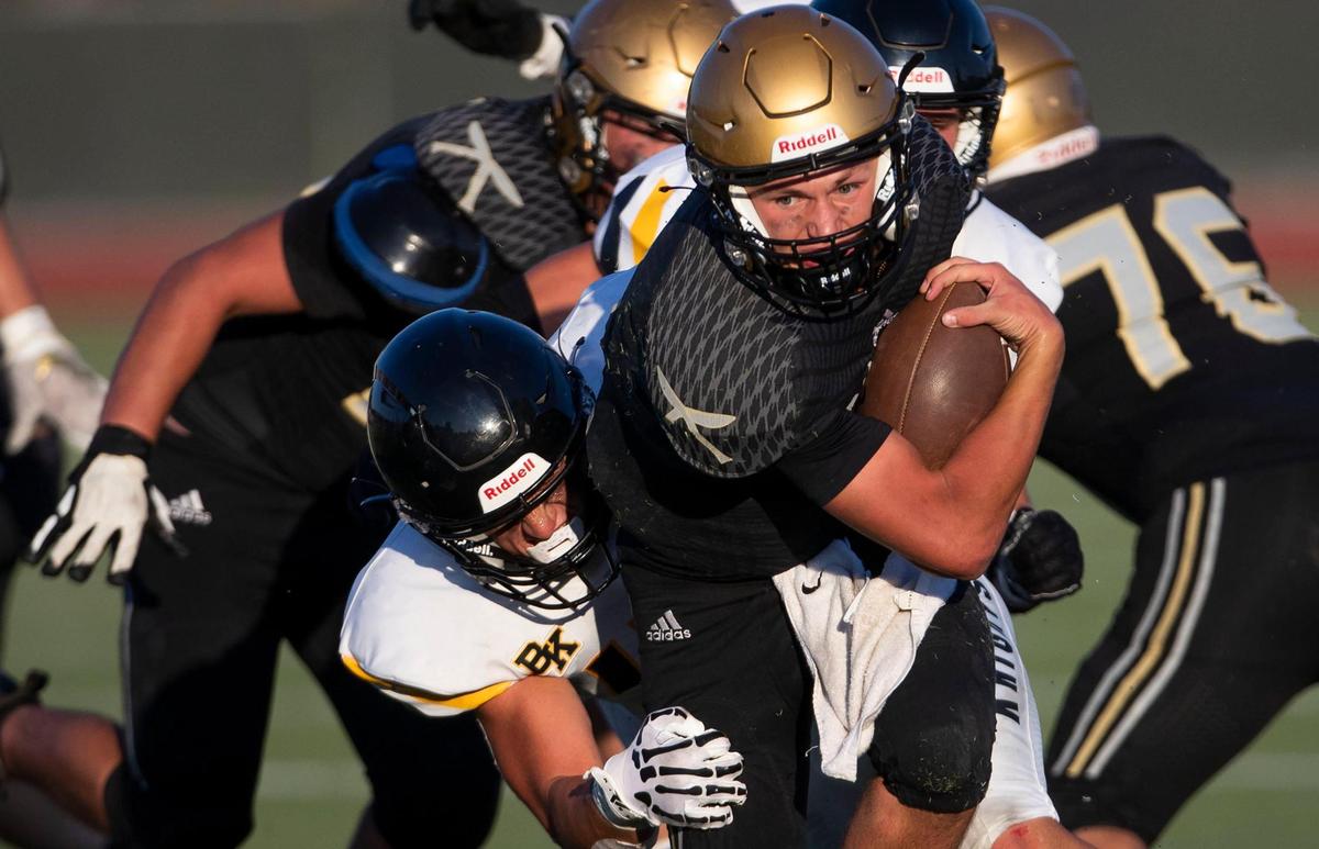 Former Capital quarterback Joren Peterson, with ball, takes over at the Eagles’ top running back this fall.