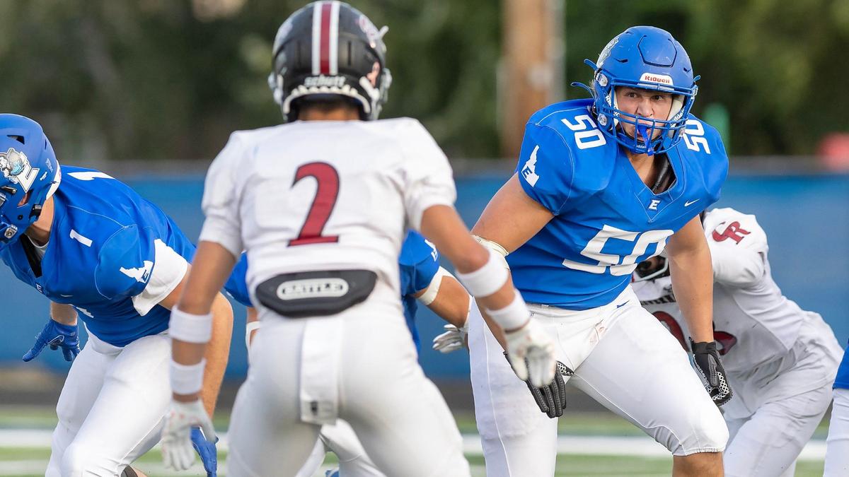 Emmett senior offensive lineman Sam Buck sets his sights on Canyon Ridge’s Brenner Kunz on Friday.