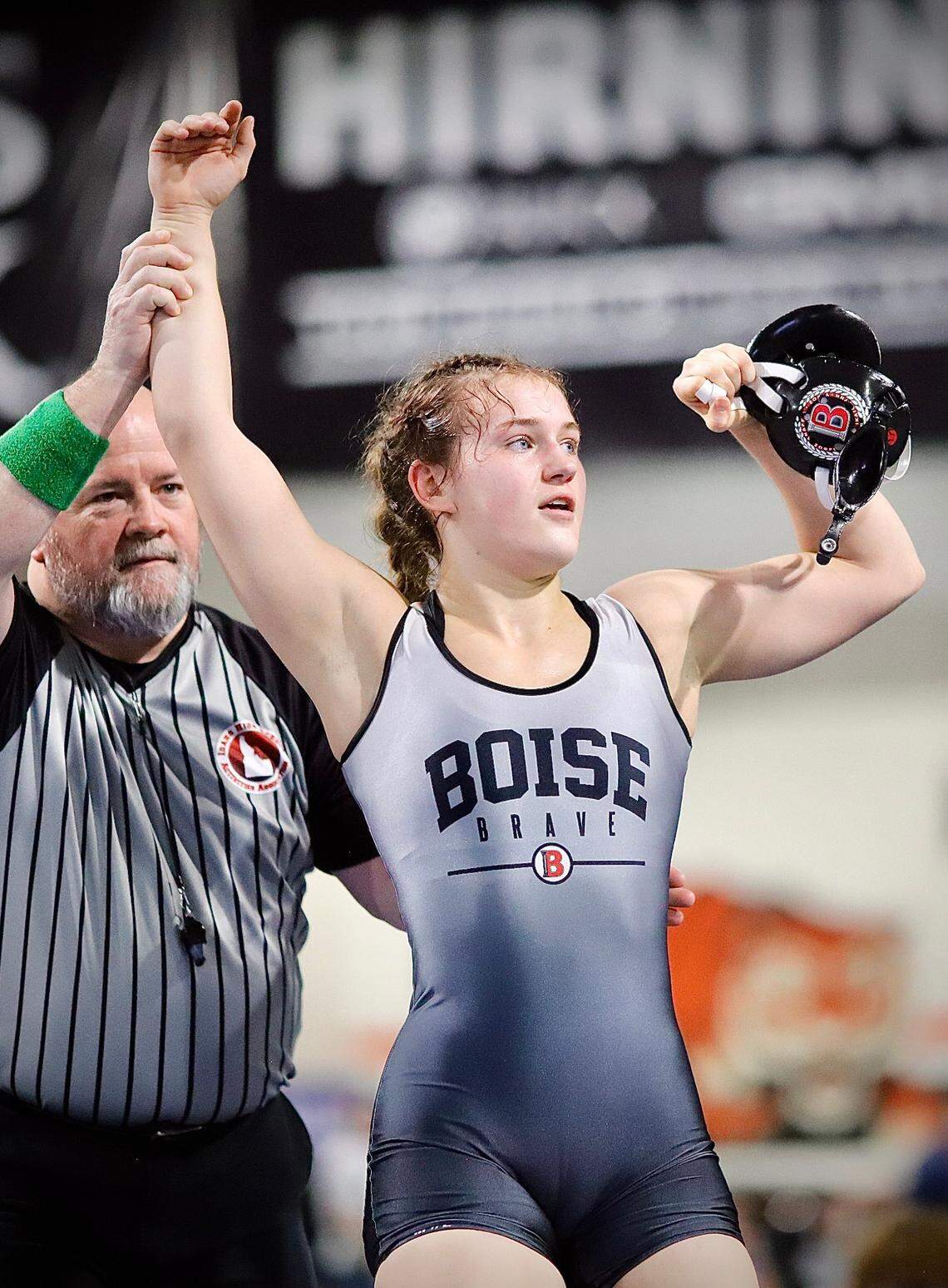 Boise’s Claire Waite has her hand raised in victory Saturday after claiming the state wrestling championship at 145 pounds.