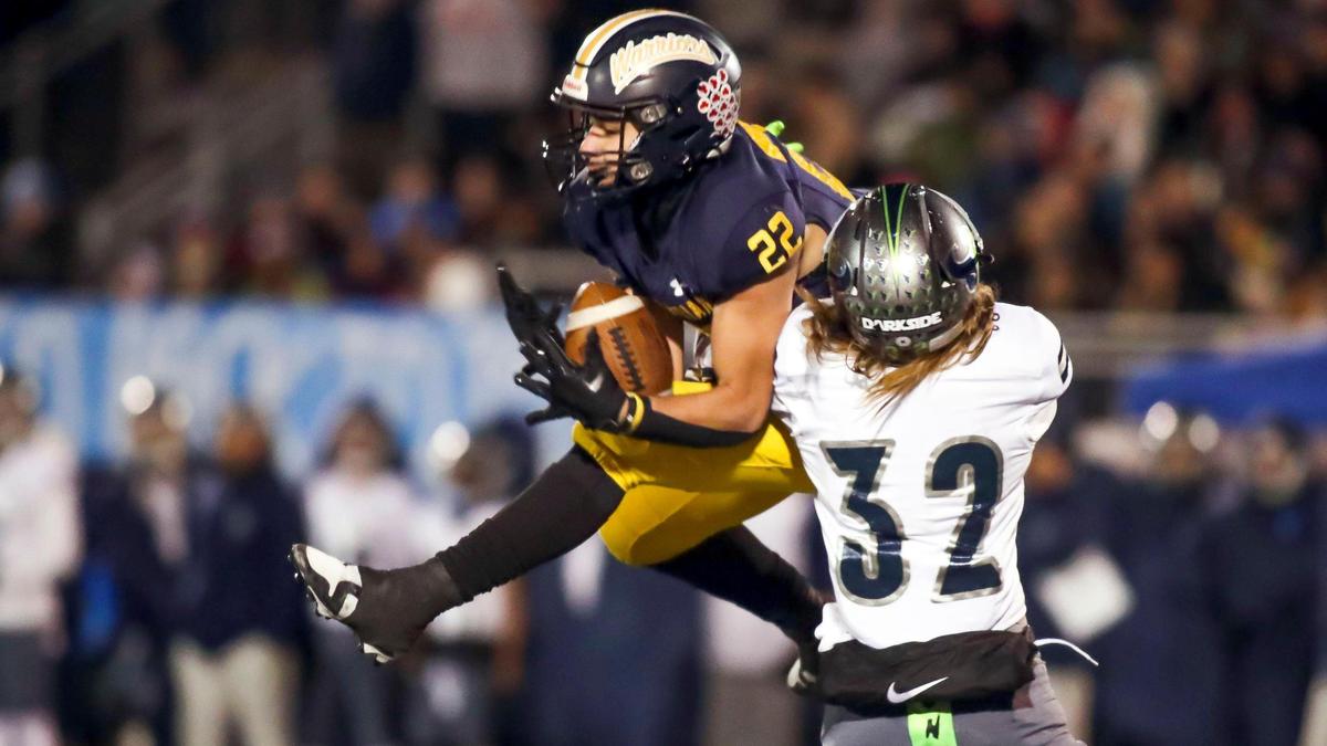Meridian running back Rylie Byington jumps for a catch in the 5A state semifinals last year. He returns to lead a loaded Warrior backfield this fall.