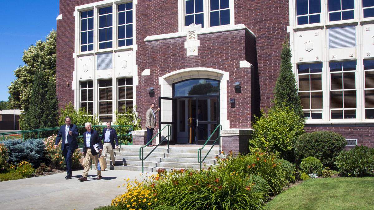 Bob Kustra leaves the administration building at Boise State on his way to lunch with his staff Friday. Kustra plans to travel with his family for a few months. "I decided I didn't want to wake up wondering why I'm not going to the office," Kustra said. "So, we're boarding a plane."