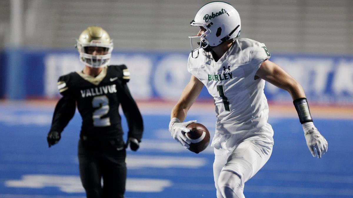 Burley wide receiver Gatlin Bair runs away from Vallivue’s Briggs Maier for a first-half touchdown Friday during the Battle in Boise at Albertsons Stadium.