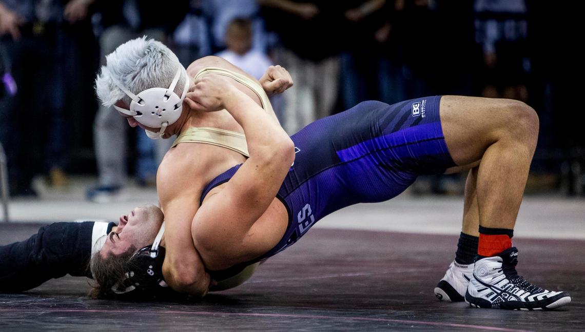 Abe Turpen, Capital, scores points on a nearfall on Rocky Mountain’s Bronson Staley in the 5A 195-pound state wrestling championship Saturday, Feb. 29, 2020 at Ford Idaho Center in Nampa.