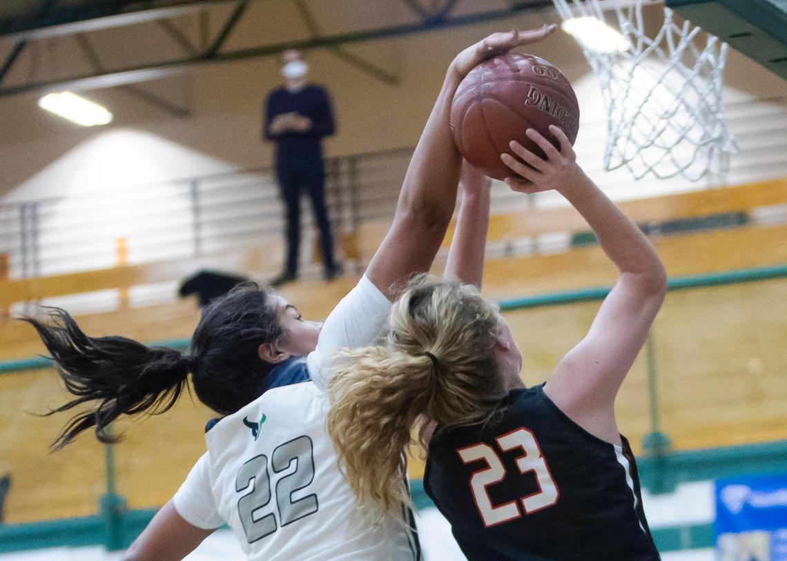 Mountain View forward Naya Ojukwu blocks a shot by Boise’s Avery Howell in the 5A District Three Tournament championship Friday at Eagle High School.