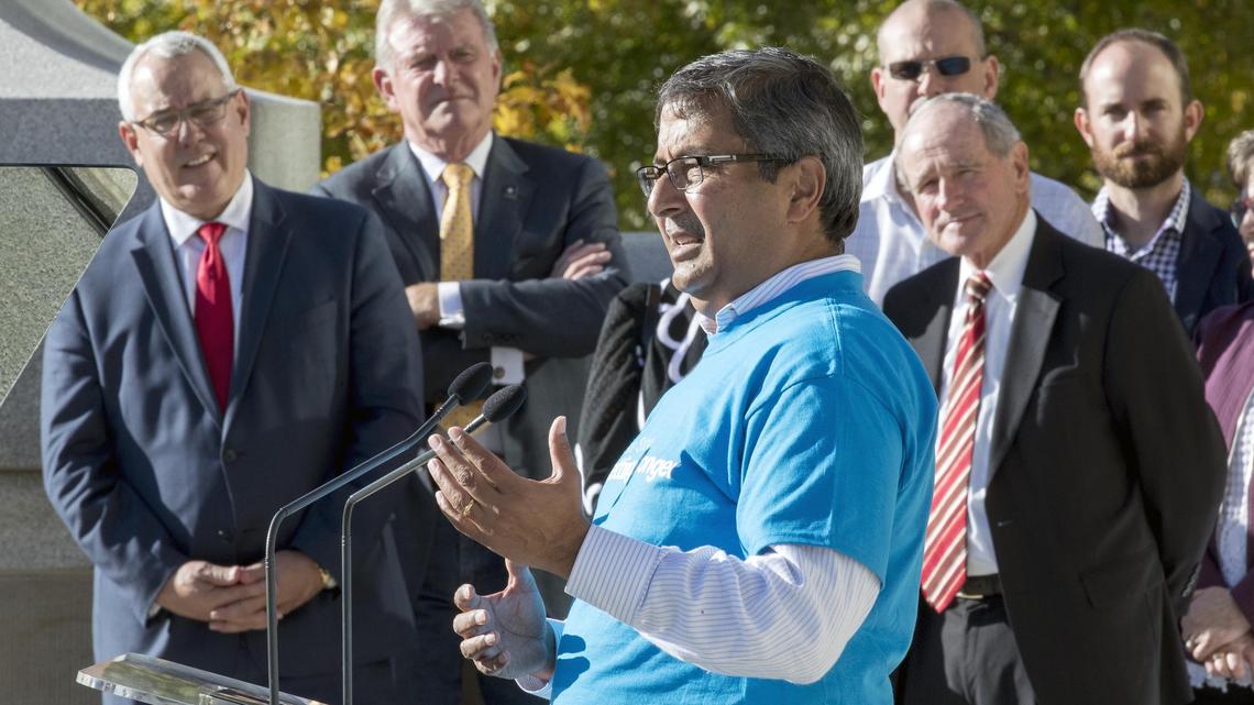 Micron Technology Inc. CEO Sanjay Mehrotra, with Idaho Gov. Butch Otter, Boise Mayor David Bieter, left, and U.S. Sen. Jim Risch, right, behind him, addresses an audience celebrating the tech company’s 40th in this 2018 file photo.