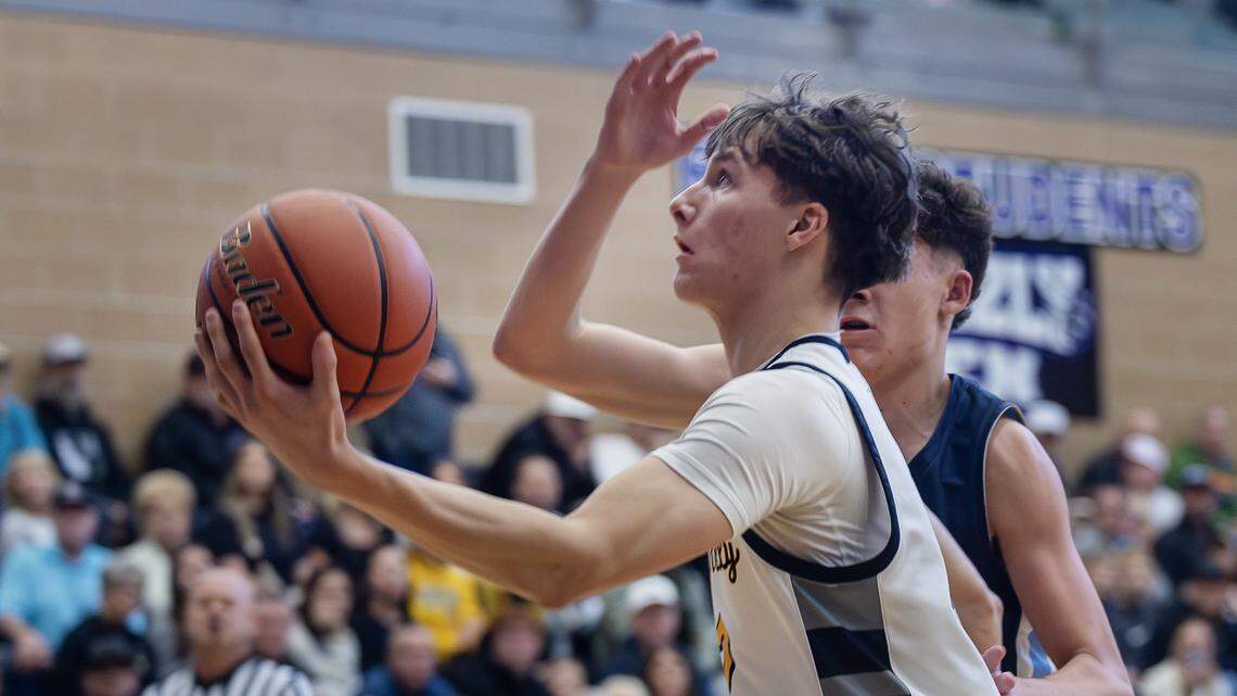 Bishop Kelly senior Conor Goss scores during their 5A boys basketball state tournament game against Twin Falls held at Rocky Mountain High School, Thursday, March 5, 2026. Bishop Kelly won 49-46.