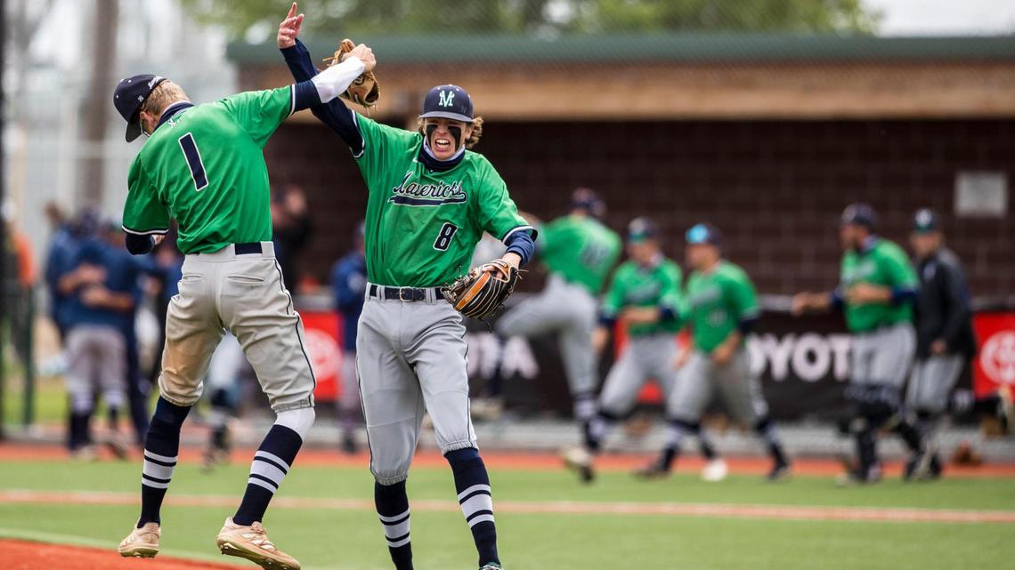 Mountain View infielders Logan Burrell (1) and Hunter Hollifield celebrate the Mavericks’ 7-5, 12-inning win over Idaho Falls in the 5A baseball state tournament Thursday, May 20, 2021, at Wolfe Field in Caldwell.