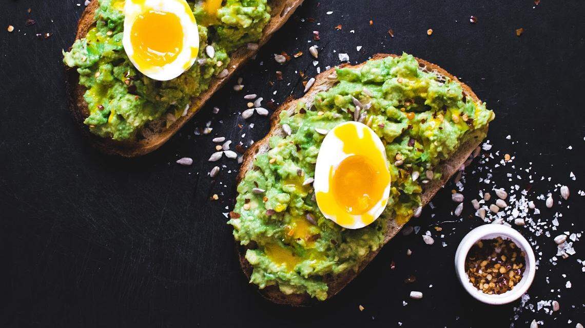 Avocado Toast at Ā Café includes smashed avocado, aleppo pepper and sunflower seeds. Go ahead. Order a Perfect 6 Minute Egg on top, too.