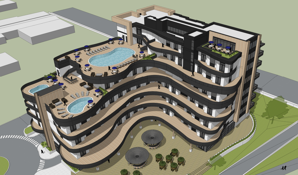 An aerial view of the Boardwalk Hotel from the northwest shows two rooftop pools, a spa and a rooftop deck.