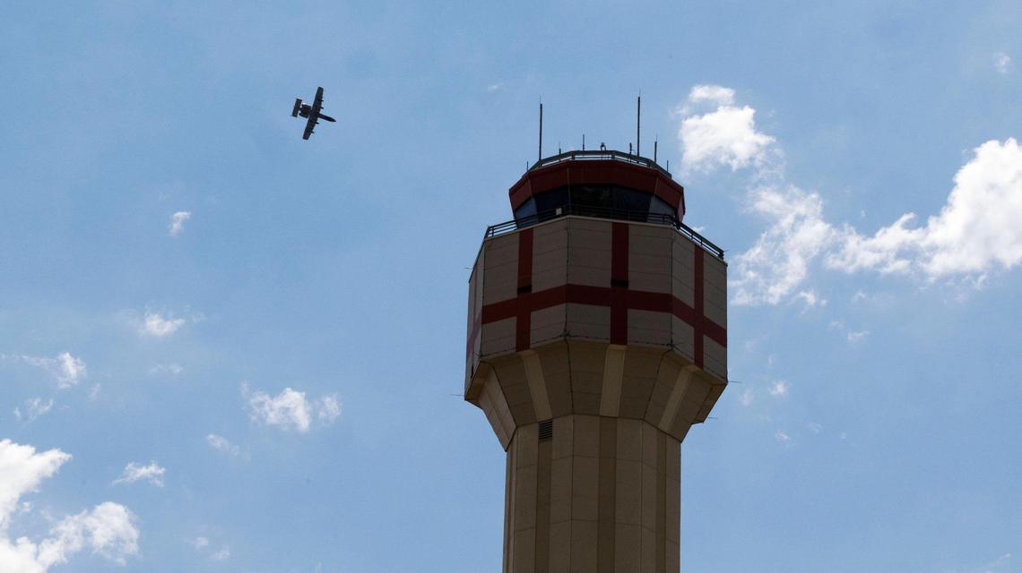 An Idaho Air National Guard A-10C Thunderbolt maneuvers through the airspace near the prominent air traffic control tower at the Boise Airport during the Aug. 26 Gowen Thunder Airshow.