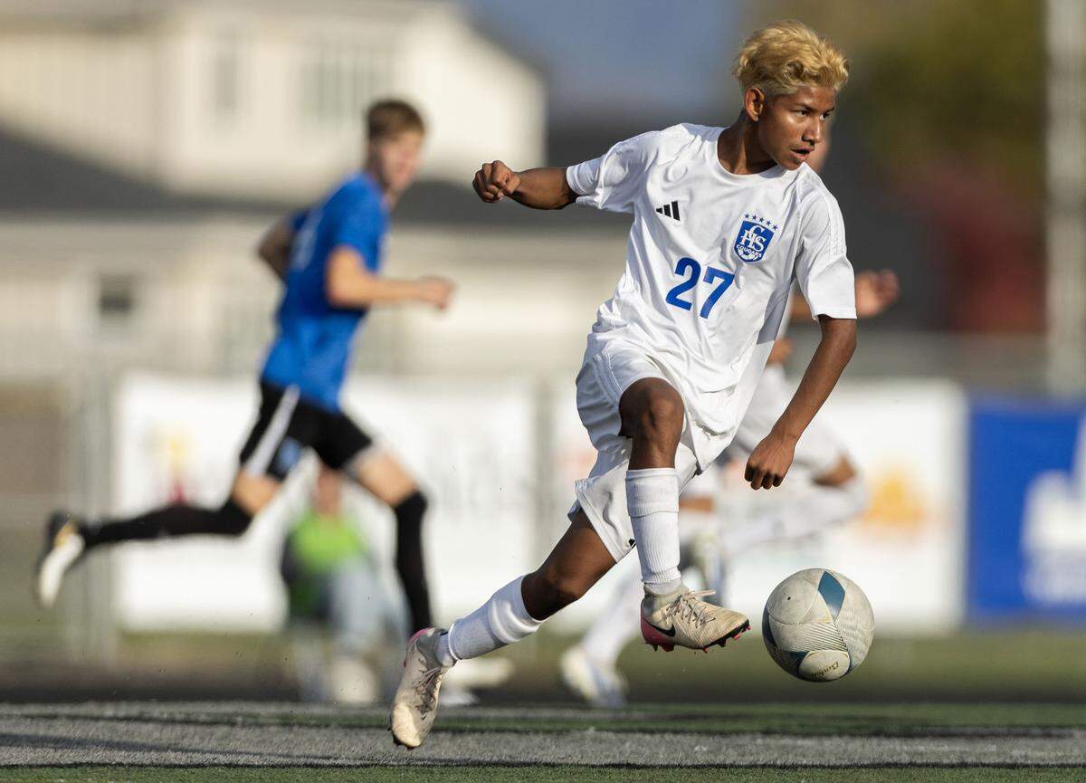 Caldwell forward Uriel Amaya pushes the ball up field against Thunder Ridge in the 6A boys soccer state semifinals at Eagle High School in Eagle, Thursday, Oct. 23, 2025.