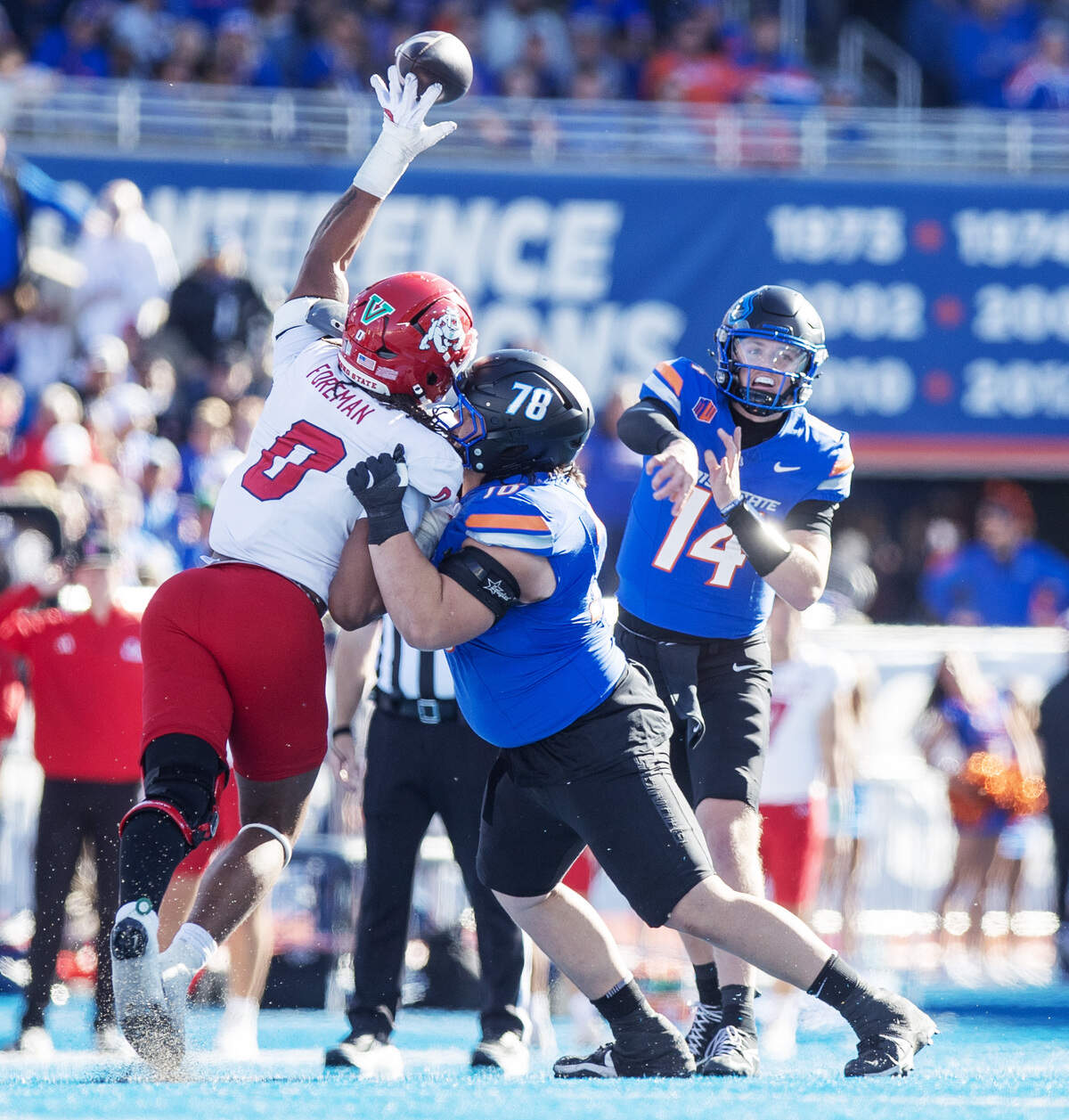 Fresno State defensive lineman Korey Foreman knocks down a pass by Boise State quarterback Max Cutforth in the Broncos’ blowout loss at Albertsons Stadium on Nov. 1.