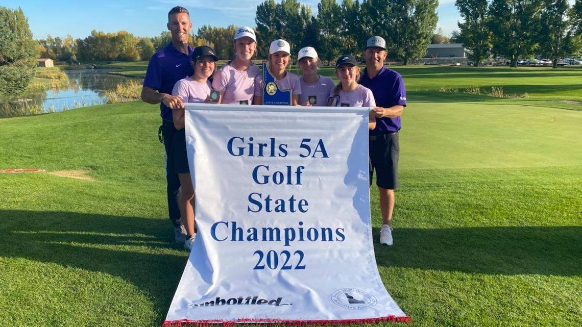The Rocky Mountain girls golf team poses with its 5A state championship trophy and banner at Teton Lakes Golf Course in Rexburg.