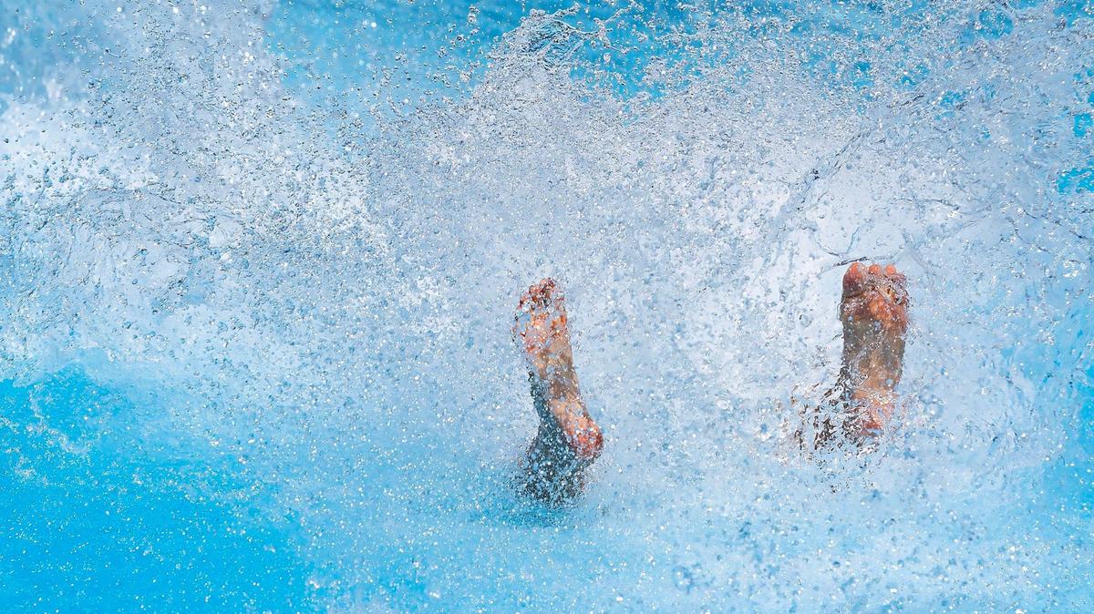 A kid splashes off a slide into the water at Roaring Springs Waterpark in Meridian in this 2024 file photo. The water slides will be up and running this weekend for what could be the first 90-degree day of 2026. 