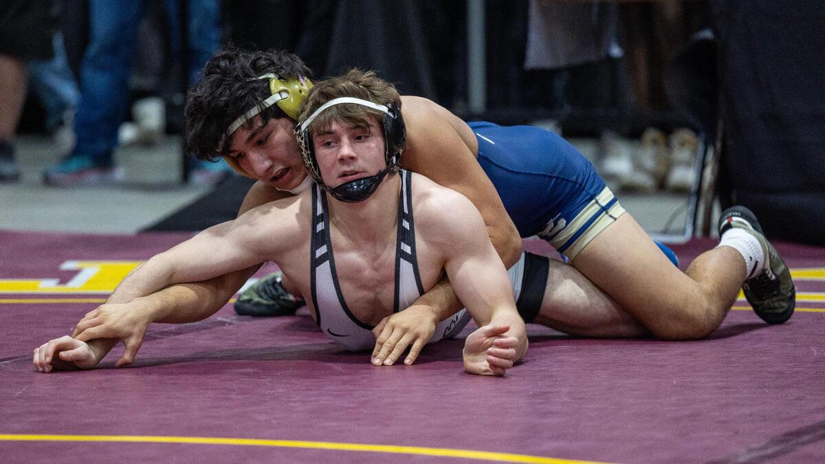 Bishop Kelly’s Jake Castagneto, bottom, is searching for his third state title this weekend in Pocatello.