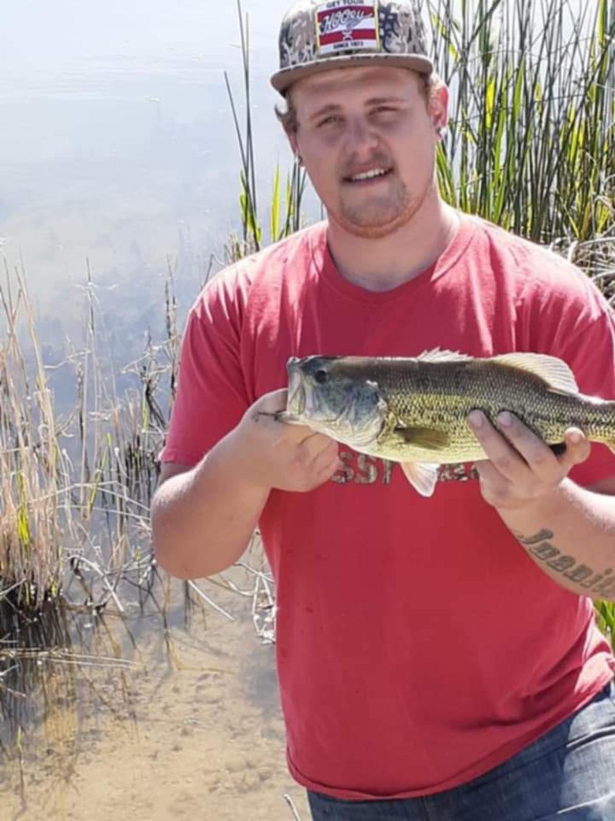 Justin Friesner shows off a fish.