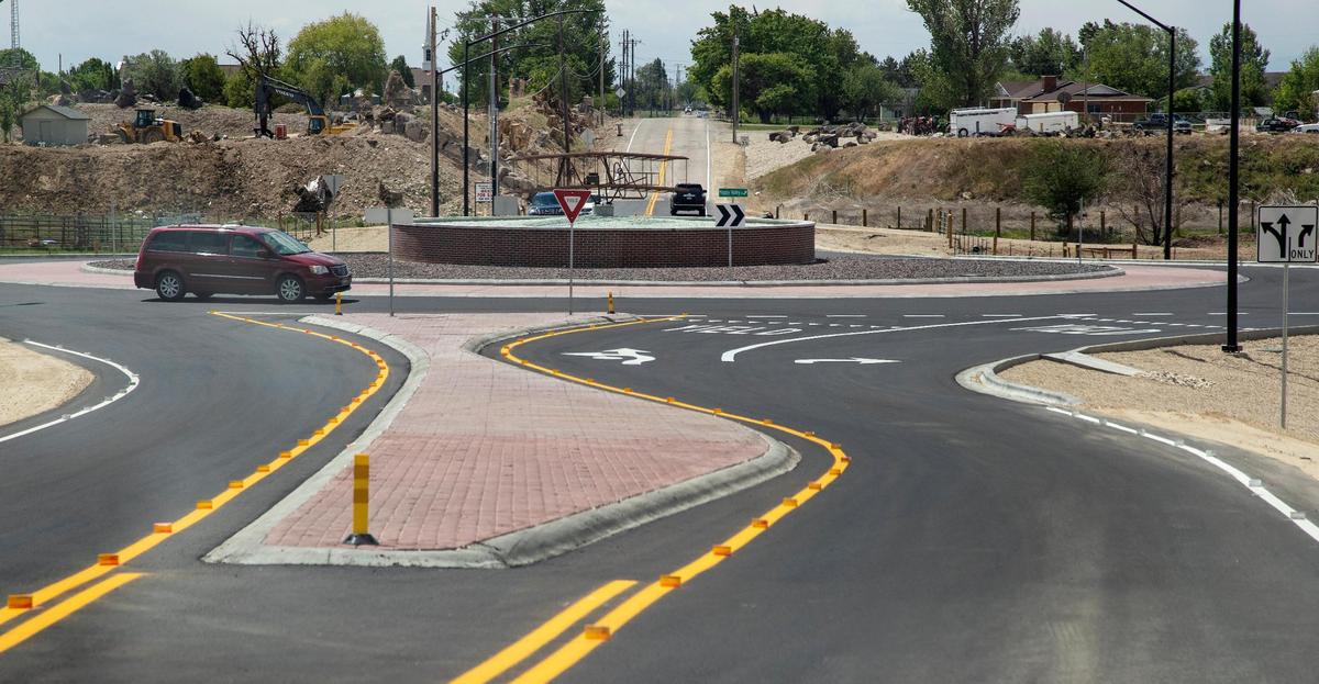 A vehicle enters the roundabout at Victory Rd. and Happy Valley Road. In areas of growth in Nampa, roundabouts are replacing congested intersections.