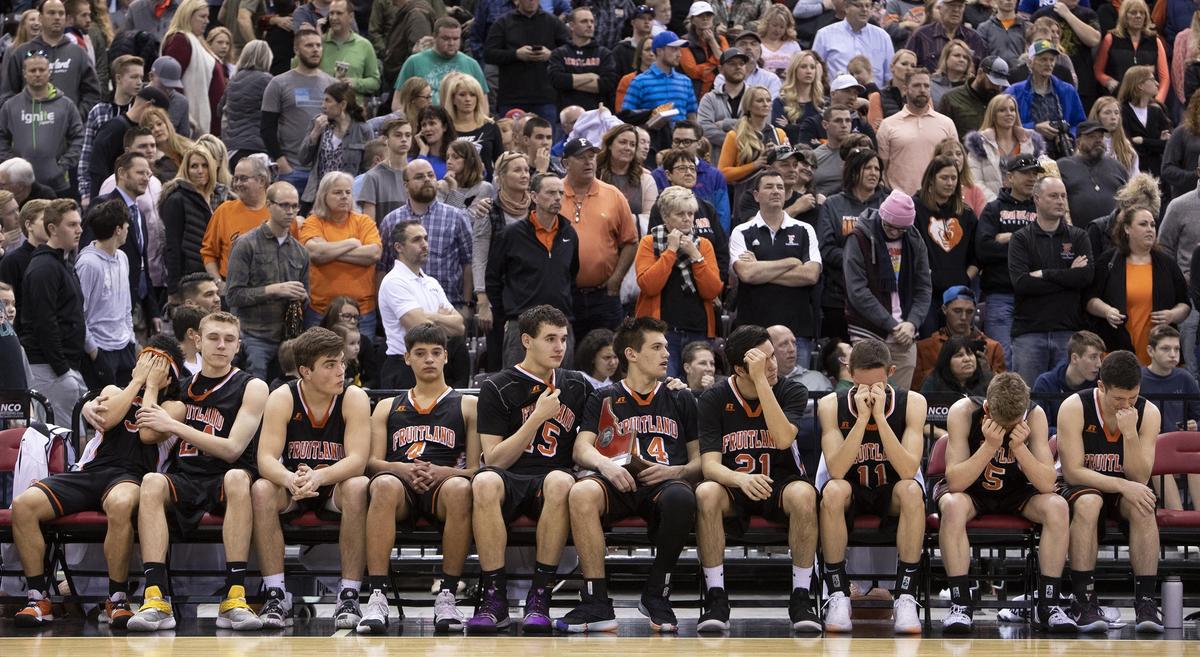 Fruitland’s boys basketball team, and its community of fans behind them, wait to receive the runnerup trophy after falling to Sugar-Salem 57-47 in the state 3A championship Saturday, March 2, 2019 at Ford Idaho Center in Nampa.