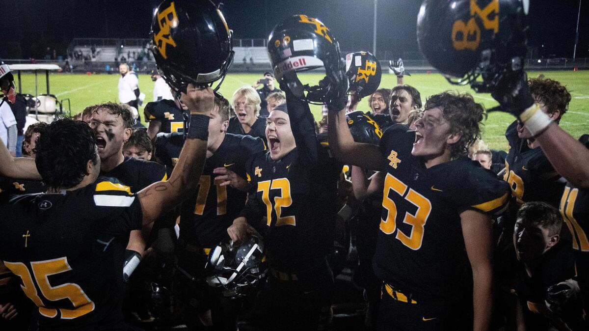Bishop Kelly celebrates its win over Vallivue earlier this season.