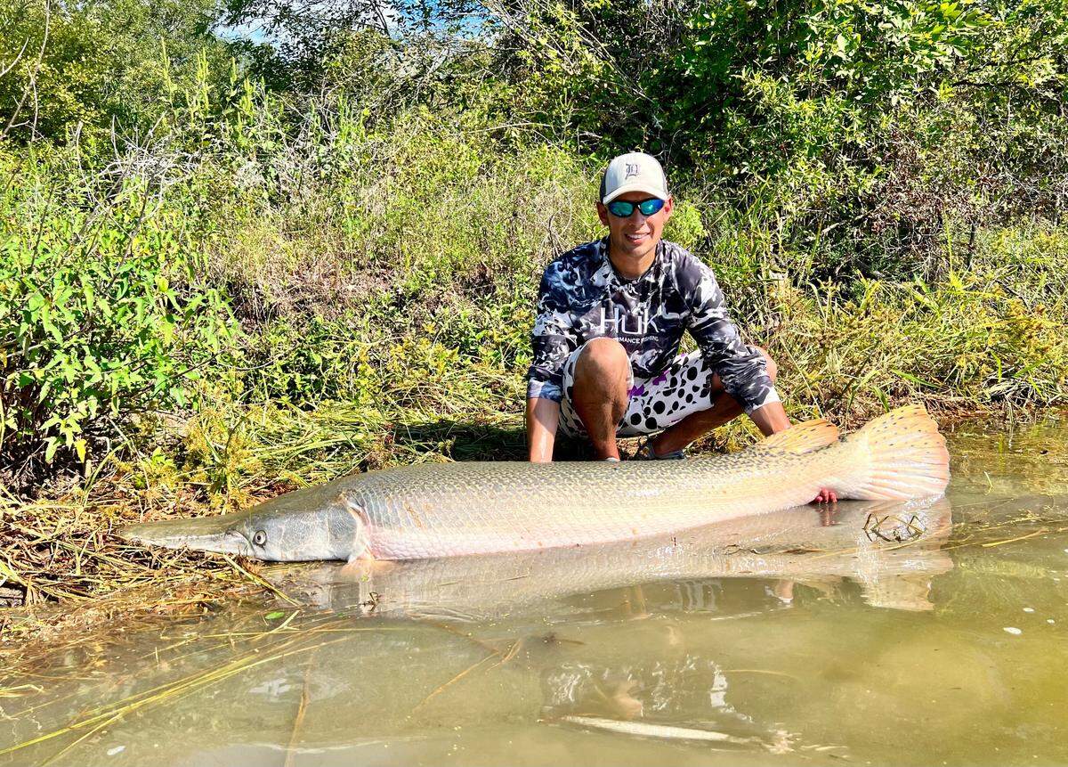 At 6-foot-7 and 130 pounds, this Texas alligator gar was a new personal-record catch for fishing columnist Jordan Rodriguez. 