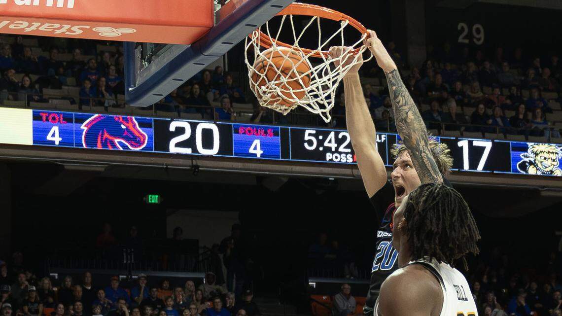 Boise State forward Drew Fielder dunks the ball after a baseline move on Wichita State forward Noah Hill in the first half at ExtraMile Arena in Boise, Tuesday, Nov. 18, 2025.