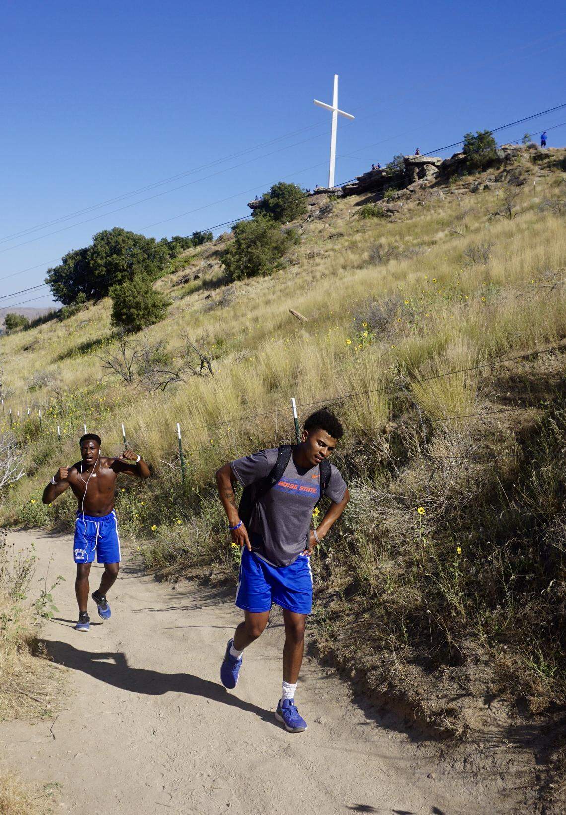 Junior wide receiver CT Thomas, left, has a little fun hiking to Table Rock with freshman quarterback Kaiden Bennett.