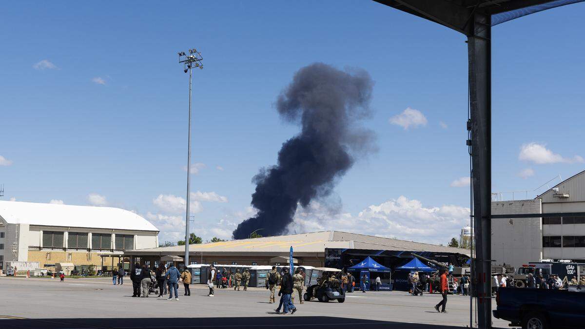Smoke rises after a mid-air collision accident between two E/A-18G “Vikings” Growler aircraft during the Gunfighter Skies Air Show at Mountain Home Air Force Base, Sunday, May 17, 2026. All four Navy pilots parachuted from the aircrafts during the crash.