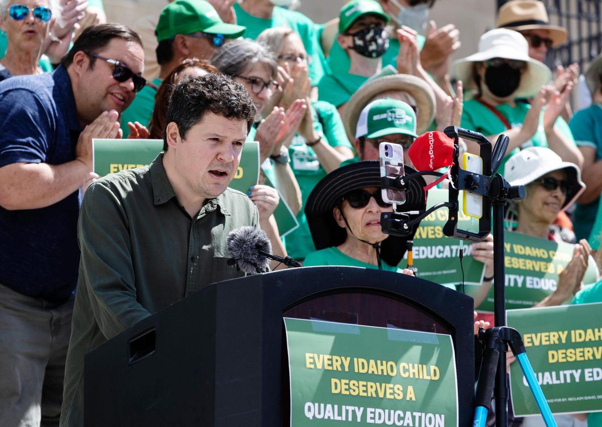 Luke Mayville, co-founder of Reclaim Idaho announces that the group has collected more than 100,000 signatures for their Quality Education Act initiative during a press conference at the Idaho Capitol on Wednesday, July 6, 2022.