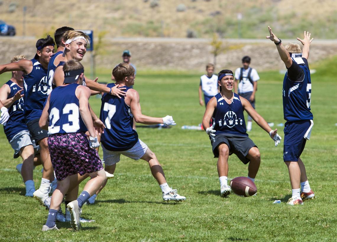Skyview celebrates its semifinal victory over Madison at the Famous Idaho Potato Bowl 7-on-7 Tournament Saturday at the Optimist Youth Sports Complex in Northwest Boise. The Hawks, who move up to the 5A classification this fall, went on to win the tournament, beating crosstown rival Nampa.