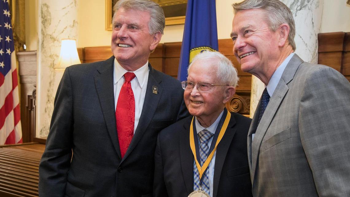 Former Idaho Gov. Phil Batt, center, receives the 2019 Idaho Medal of Achievement from outgoing Gov. Butch Otter, left, and then-Gov.-elect Brad Little on Jan. 3, 2019, at the Capitol in Boise.