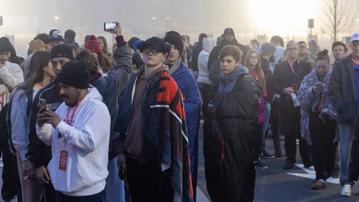 Customers form a line outside for the grand opening of Raising Cane's first Idaho location on Eagle Road in Meridian, Tuesday, Nov. 18, 2025.