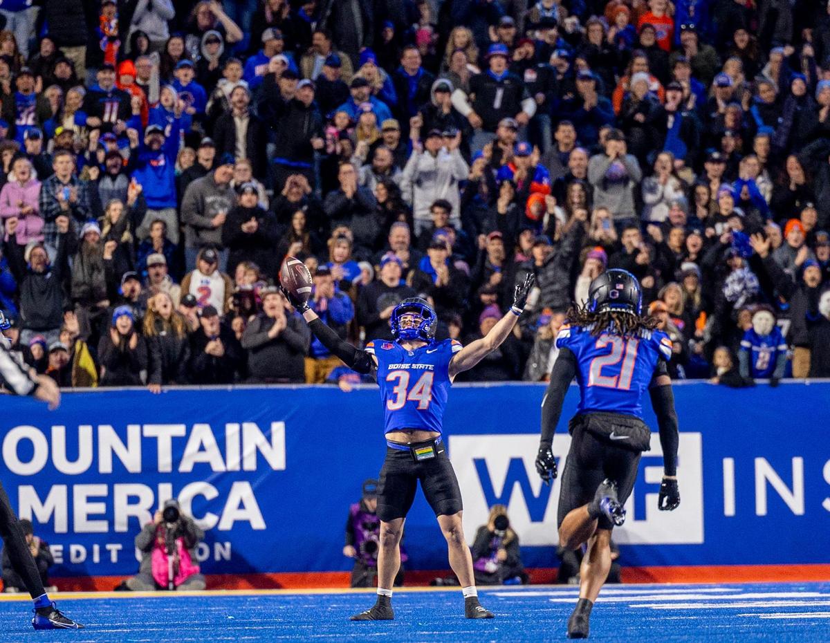 Former Boise State safety Alexander Teubner (34) takes in the cheers after intercepting a San Diego State pass in a Mountain West game last season.