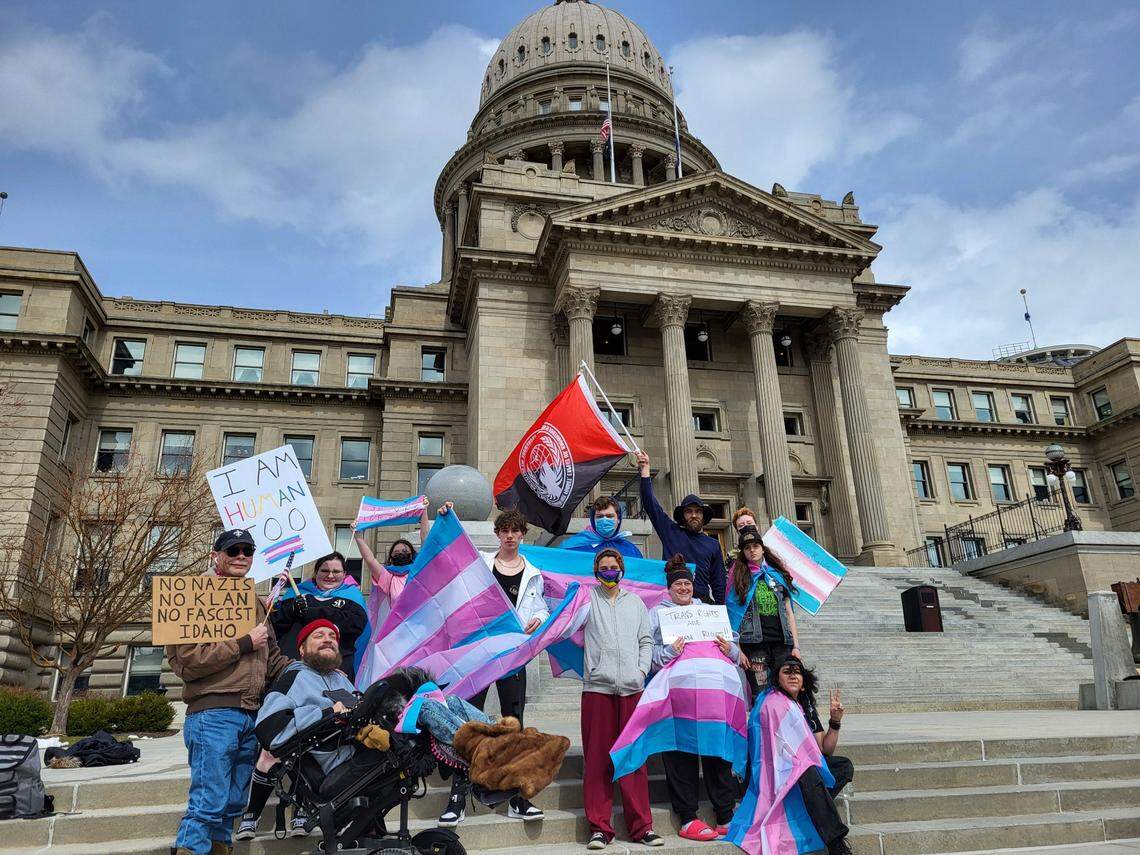 A group of people waved flags and chanted in support of LGBTQ+ rights at the Idaho Capitol building in 2023.