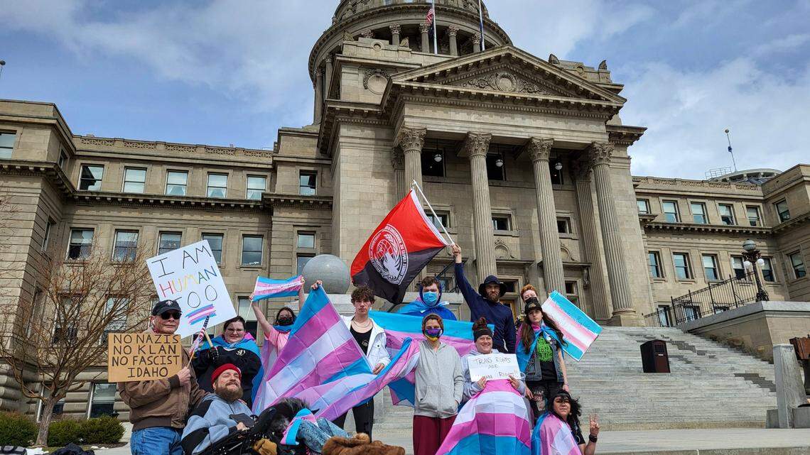 A group of people waved flags and chanted in support of LGBTQ+ rights at the Idaho Capitol building in Boise on Friday, March 31, 2023. The demonstrators said they hope Idaho Gov. Brad Little will veto House Bill 71, which would criminalize gender affirming care for transgender minors. 