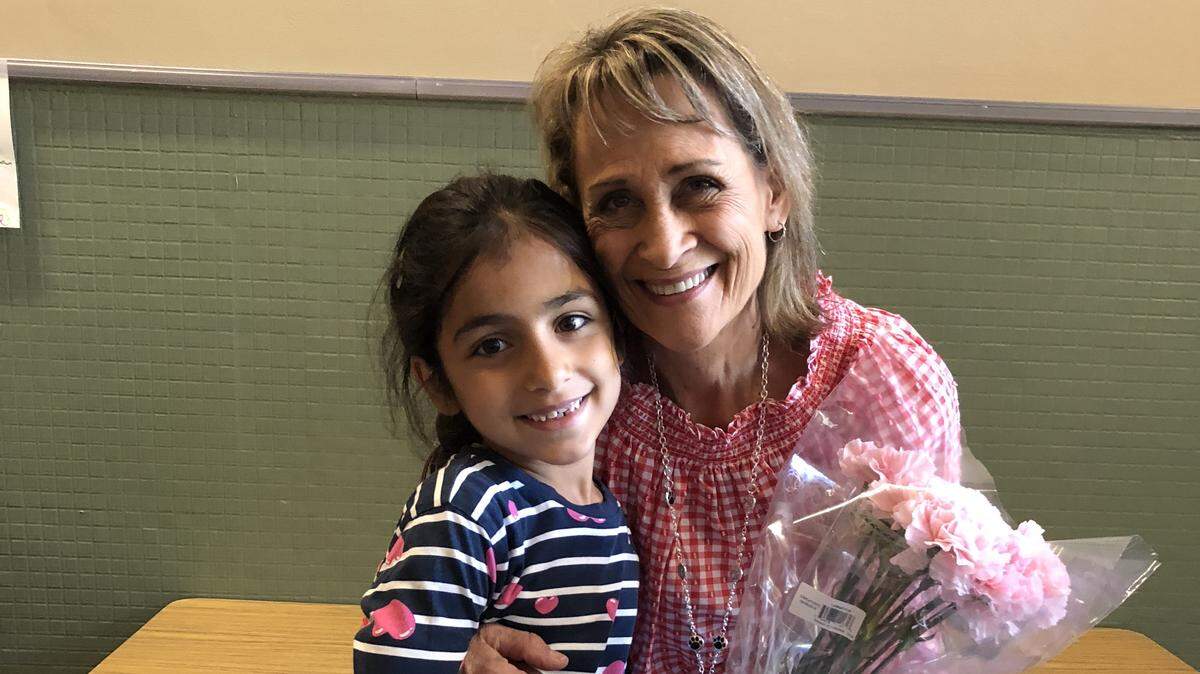 Teba Jalil, age 6, with her kindergarten teacher, Doreen Prohaska. Teba, her 8-year-old brother, Zine, and her mother, Miada Jasim, were injured in the mass stabbings Saturday, June 30, at the Wylie Street Station Apartments off State Street near Collister Drive. Teba and Zine have been released. Their  mother remains hospitalized.