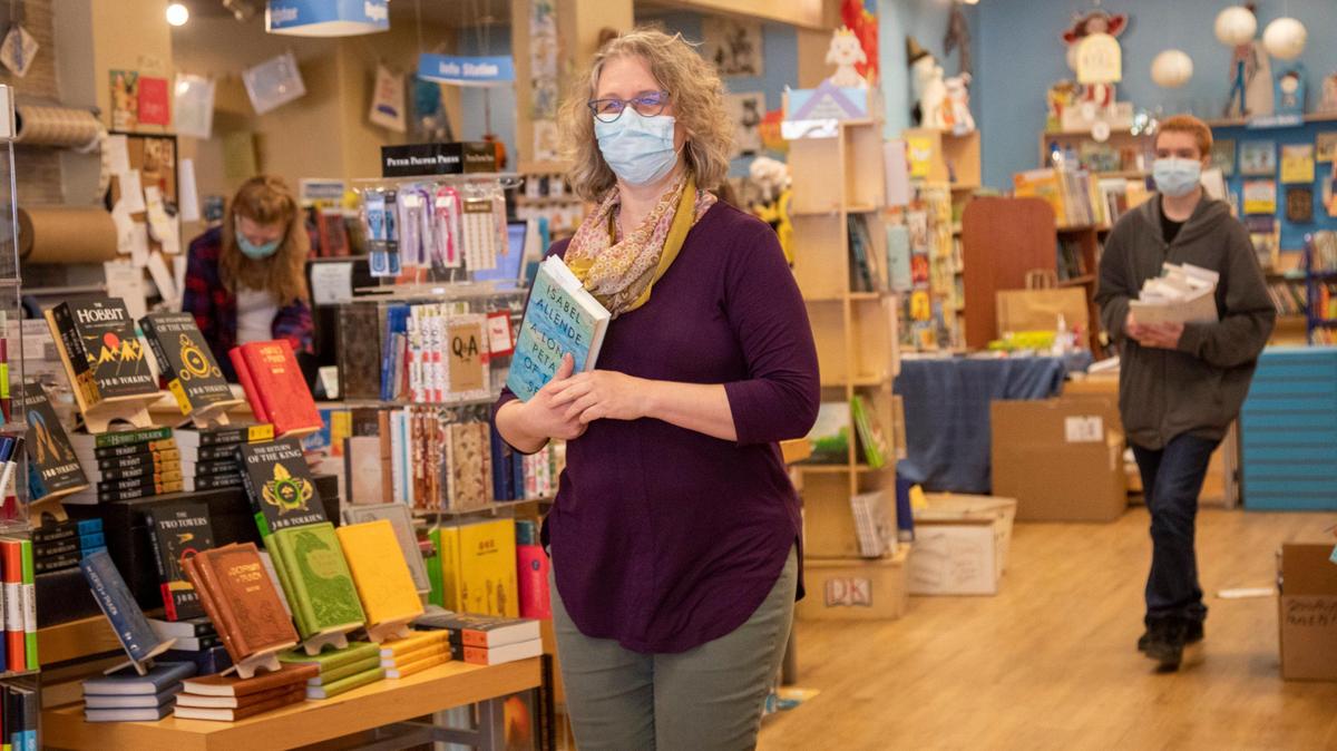 Keeping a workflow that allows 6 feet of space between workers, Laura DeLaney, co-owner of Rediscovered Books, says Gov. Brad Little’s amended orders for essential and nonessential businesses means more she can hire back employees a few at a time. The book store can now provide curbside service to customers who order books online.