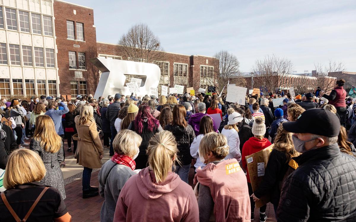 A crowd of several hundred people gathered at the Boise State University B statue to protest against comments about women made by Boise State political science professor Scott Yenor.