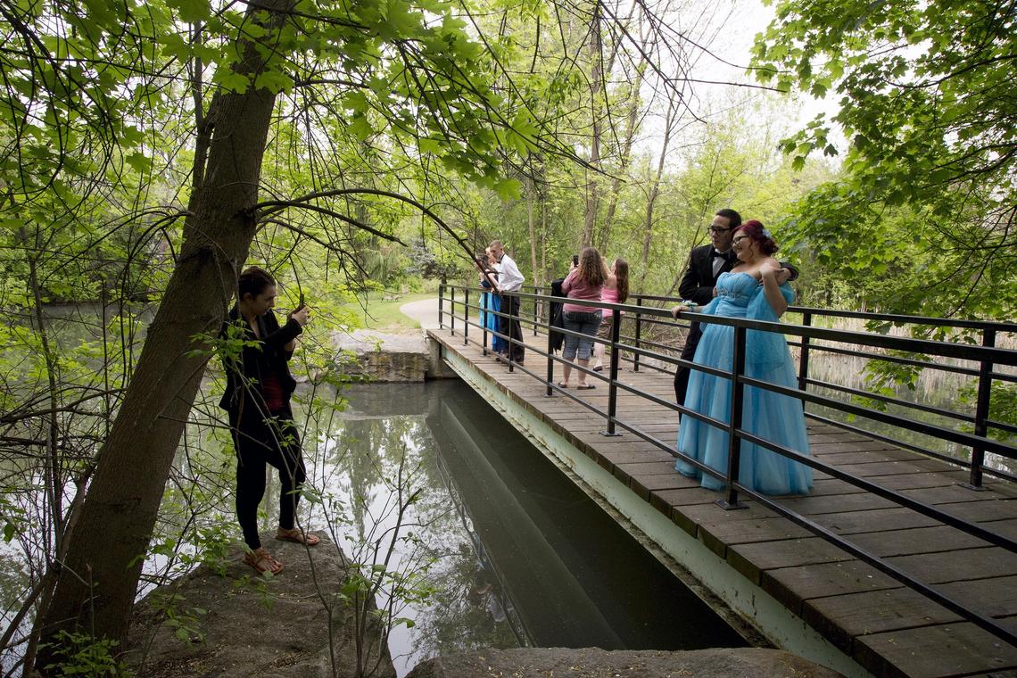 Scenic Kathryn Albertson Park is a favorite locale for photographs on important occasions. Photographer Kaylee Barnes finds a good spot to record Alex Childers, right, and Taylor Keating’s prom night.