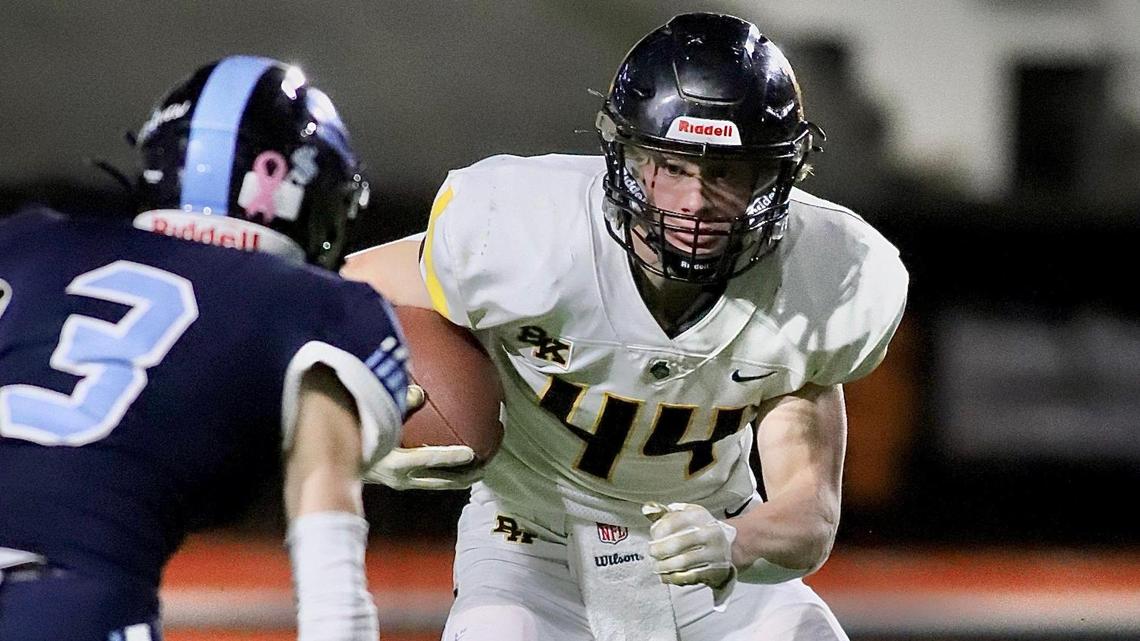 Bishop Kelly senior Peter Minnaert puts a move on Skyline defender Mckay Bird on Friday during the 4A state championship game in Pocatello.