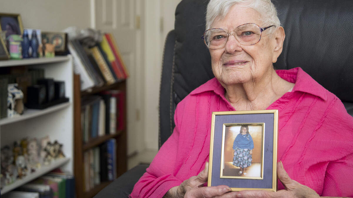 Vena Dickinson, 85, Caldwell, has lost 159 pounds in the past 27 years. She recently was named International Queen through the TOPS (Take Off Pounds Sensibly) Club program. She holds a photo of herself when she weighed 359 pounds.