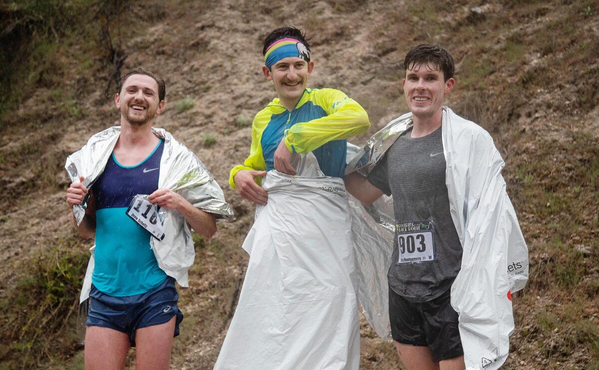 Jackson Brill, center, took first place while Greg Montgomery, right, took second and and Drew Schultz, left, took third place in overall competition at the Race to Robie Creek on Saturday.