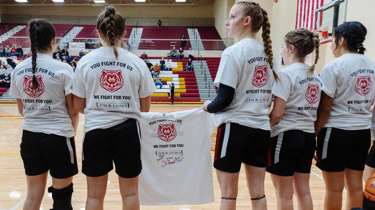 Players on the Greenleaf Friends Academy girls basketball team wear shirts and temporary tattoos in honor of Loma and Jim Bittick. The man who crashed into their truck, killing Loma and severely injuring Jim, is headed to prison.