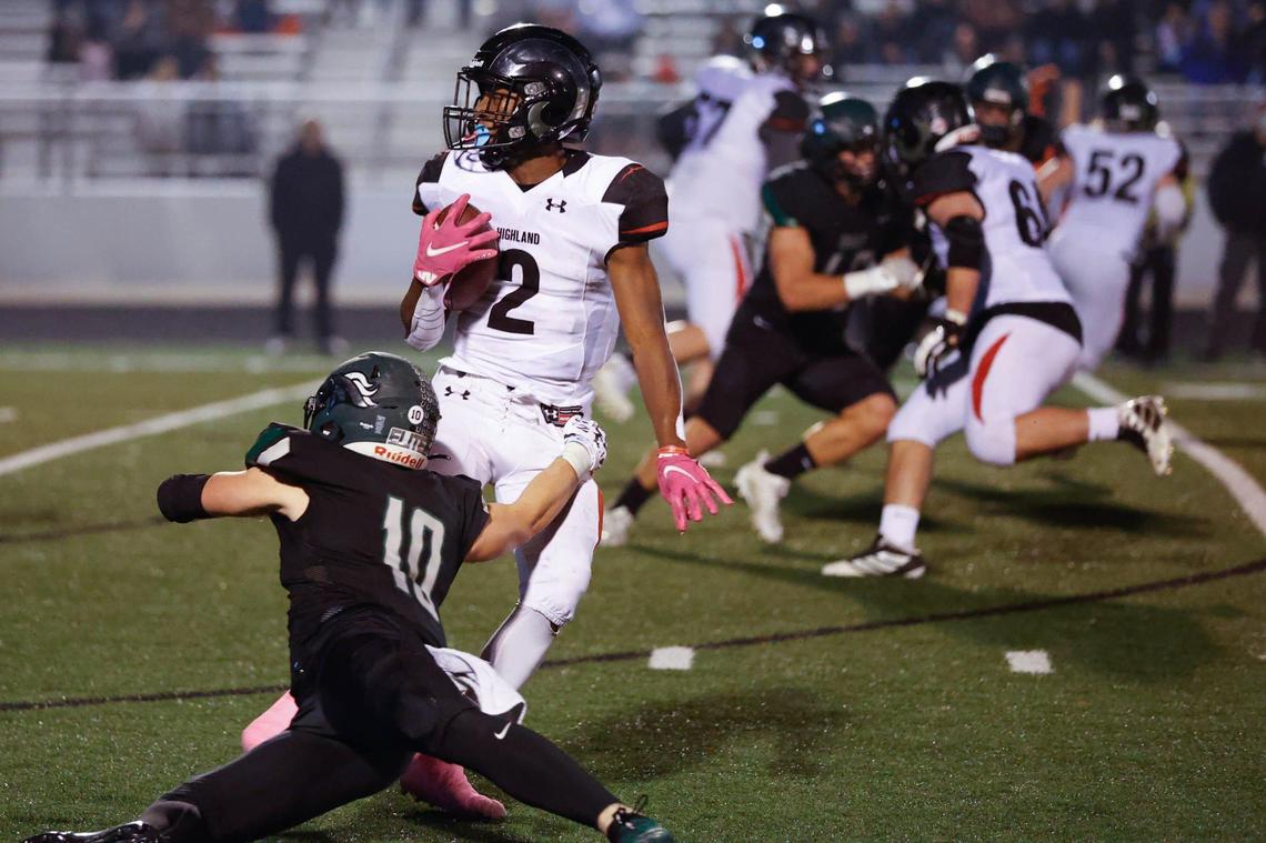 Highland’s Eli Parrish spins out the grip of Eagle’s Eli Mikita in the 5A state semifinals Friday.