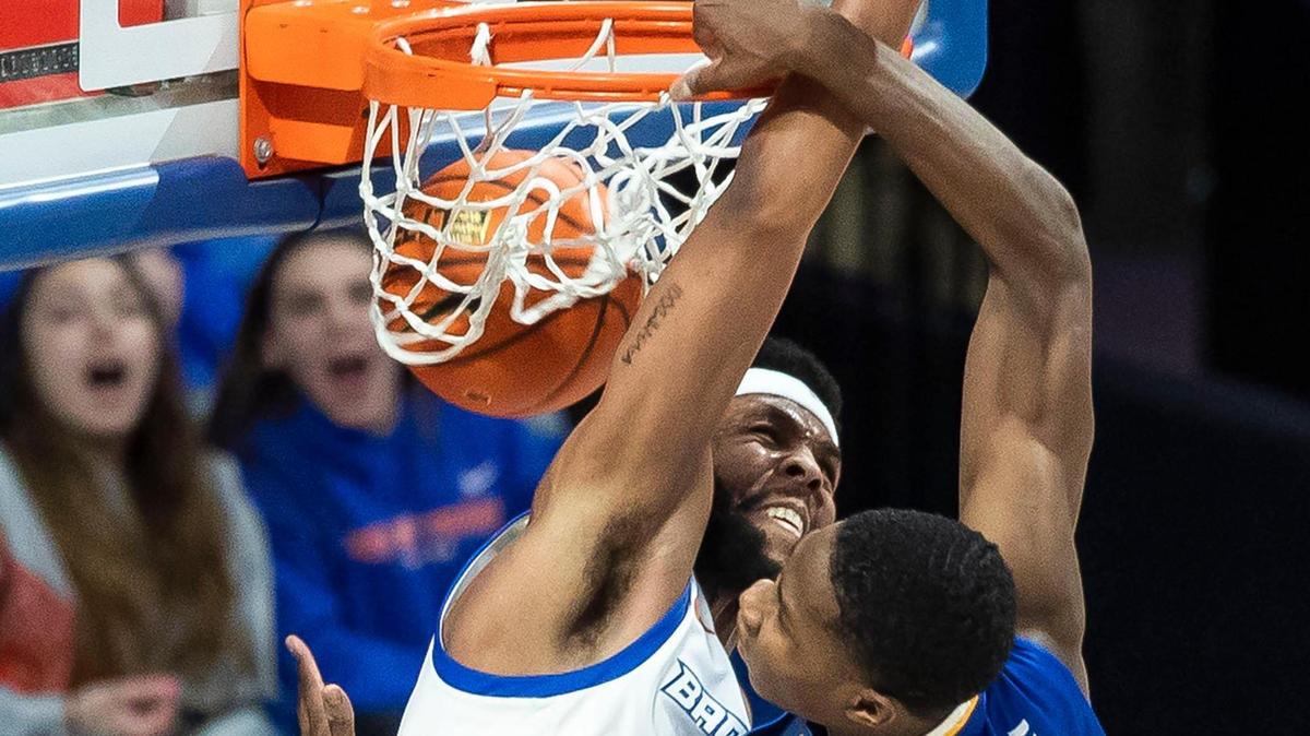 San Jose State guard Omari Moore dunks over Boise State forward Naje Smith in the second half of their game Jan. 3 at ExtraMile Arena in Boise.