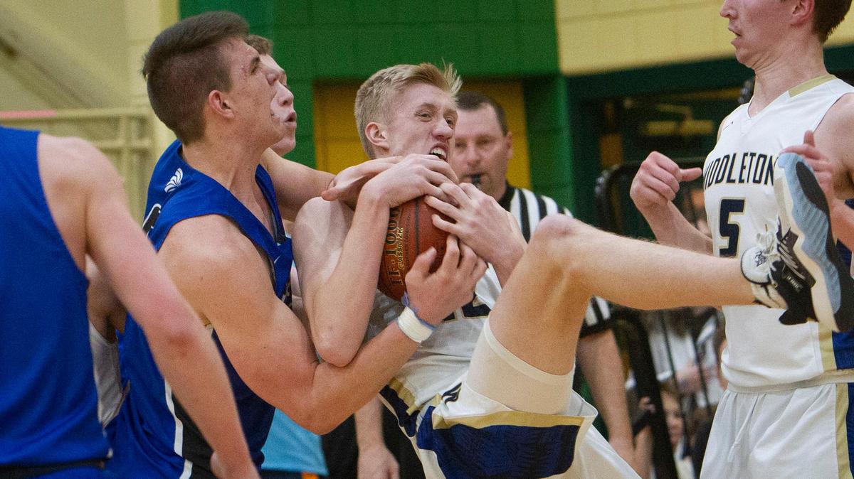 Middleton’s Tyler Medaris, center, fights for a rebound against Preston at last year’s state tournament. Middleton and Preston remain two of the favorites for the 4A title again.