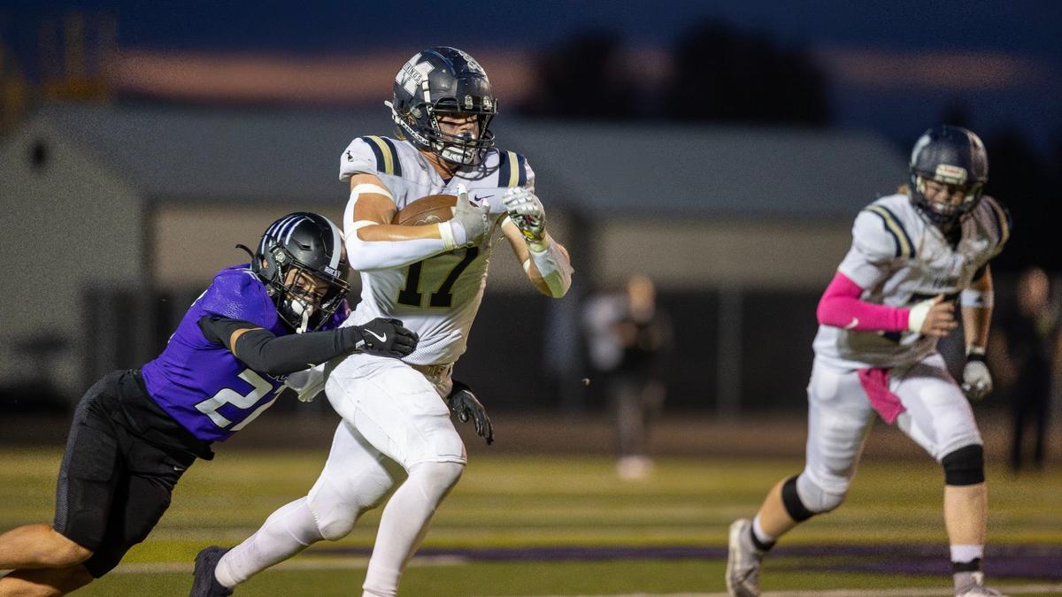 Middleton senior Drew Holman fights off a Rocky Mountain tackler on Oct. 11.