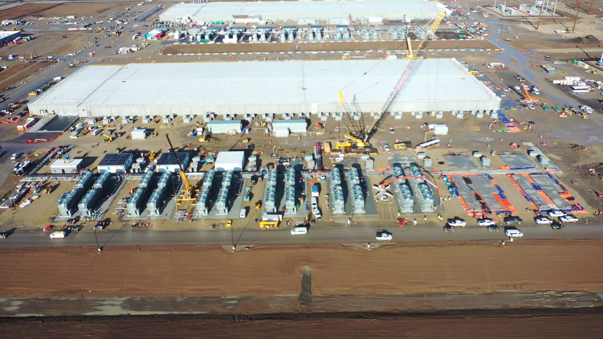 A row of pump and heat exchanger enclosures, topped with the fans used for cooling, are being worked on at Meta’s data center in Kuna. Meta says the center would use less water, in part because Idaho’s climate would allow the center to be cooled using outdoor air for more than half the year.