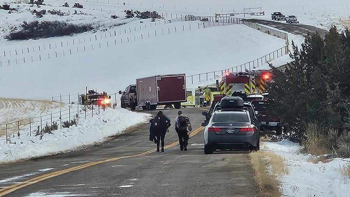 Emergency-services crews respond Thursday to the helicopter crash.